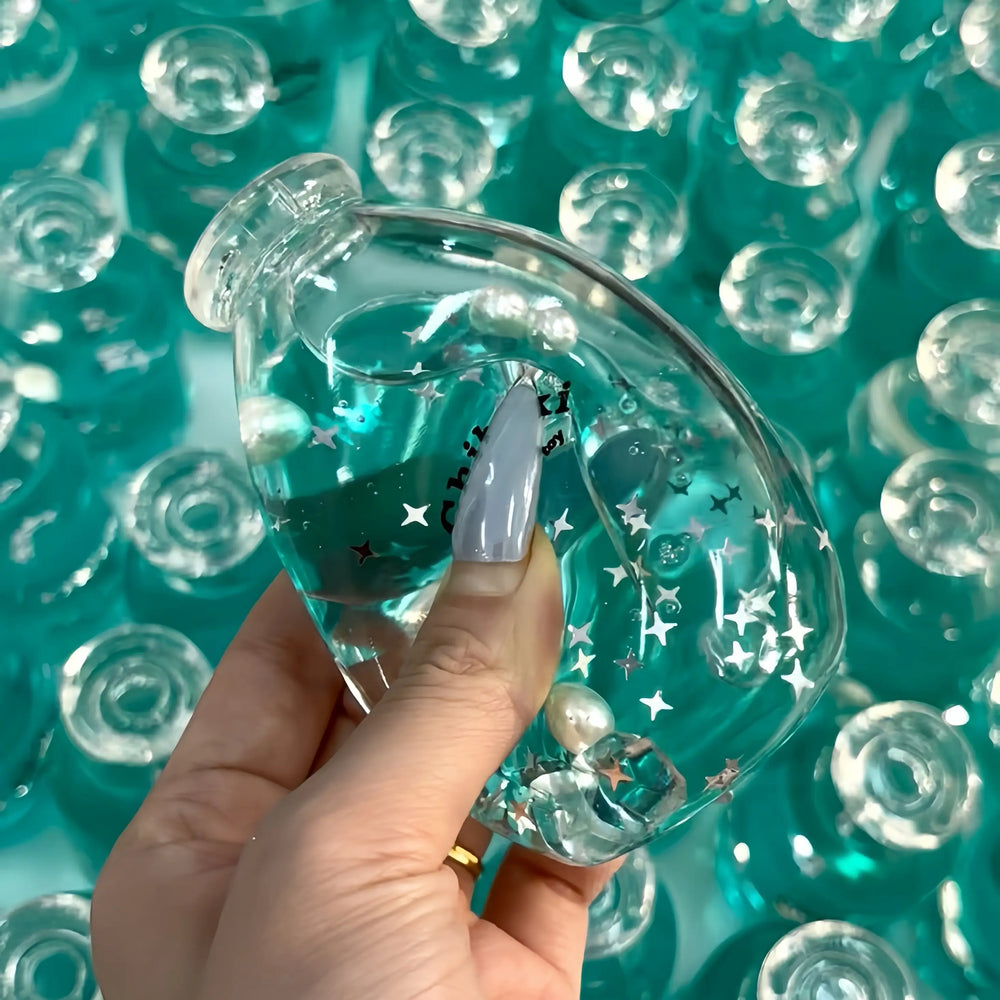 Squishies CHIBOKI de botellas con arena por capas