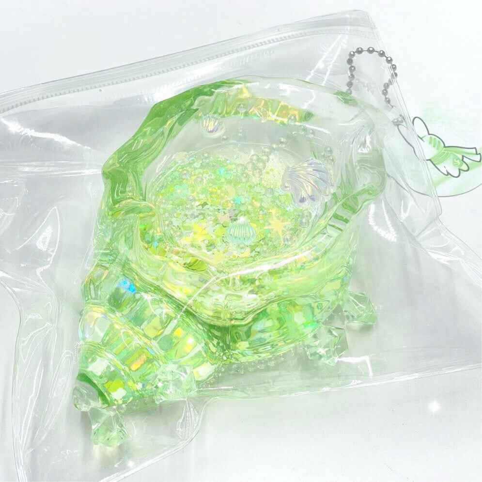 Squishy de concha con purpurina holográfica