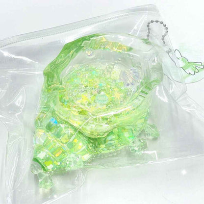 Squishy de concha con purpurina holográfica