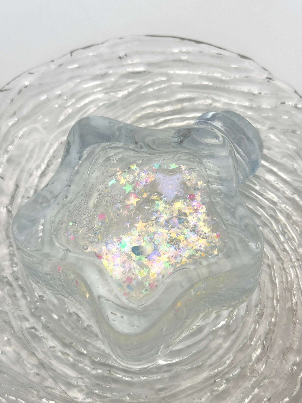 Squishy de botella estrella con arena fluida