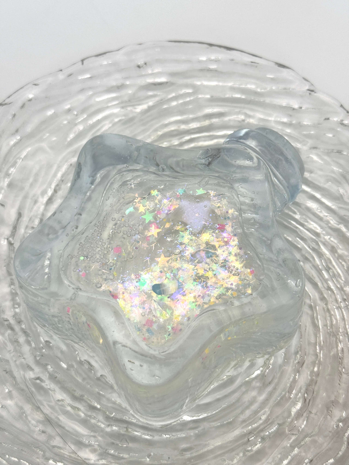 Squishy de botella estrella con arena fluida