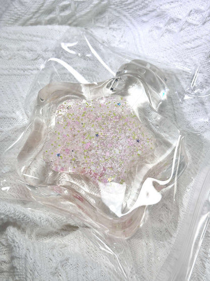 Squishy de botella estrella con arena fluida