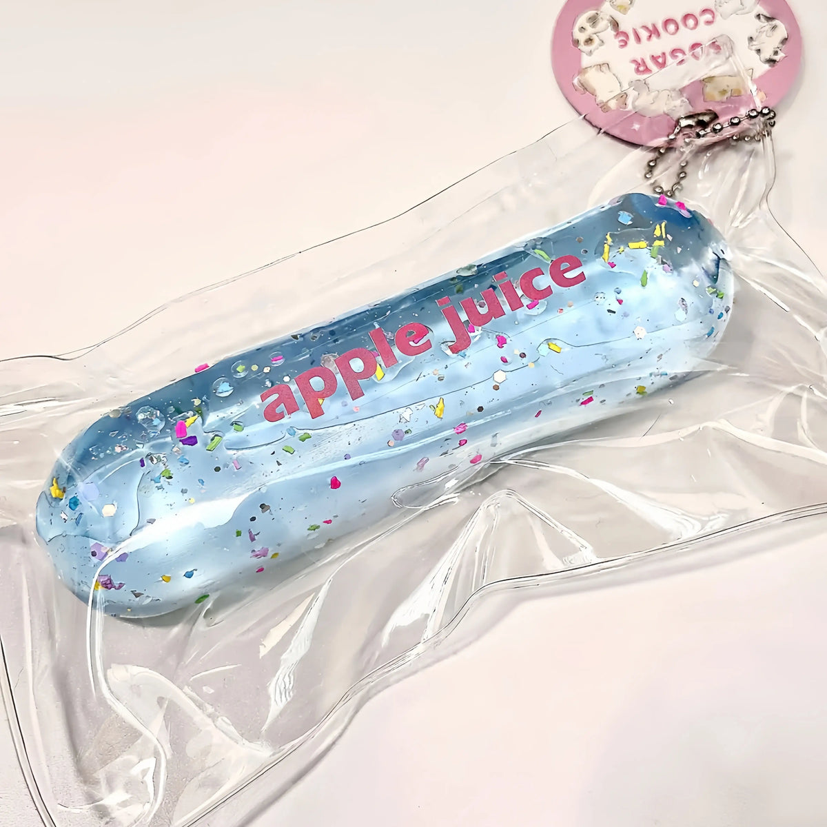 Squishy Milk Stick con purpurina y cadena
