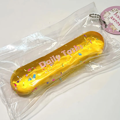 Squishy Milk Stick con purpurina y cadena