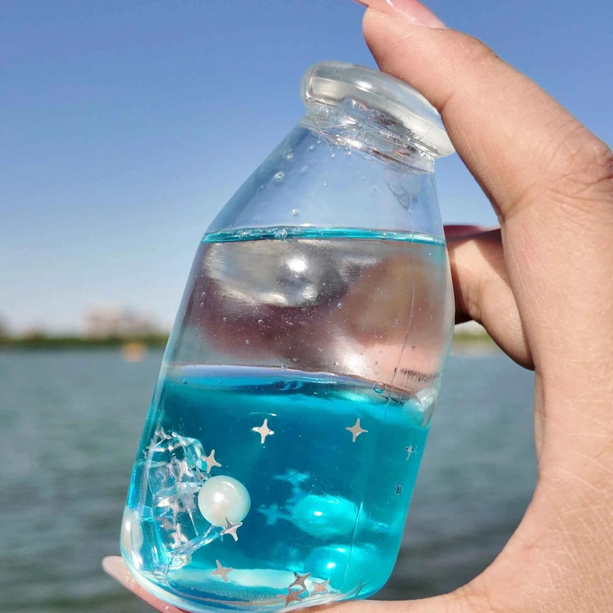 Squishies CHIBOKI de botellas con arena por capas