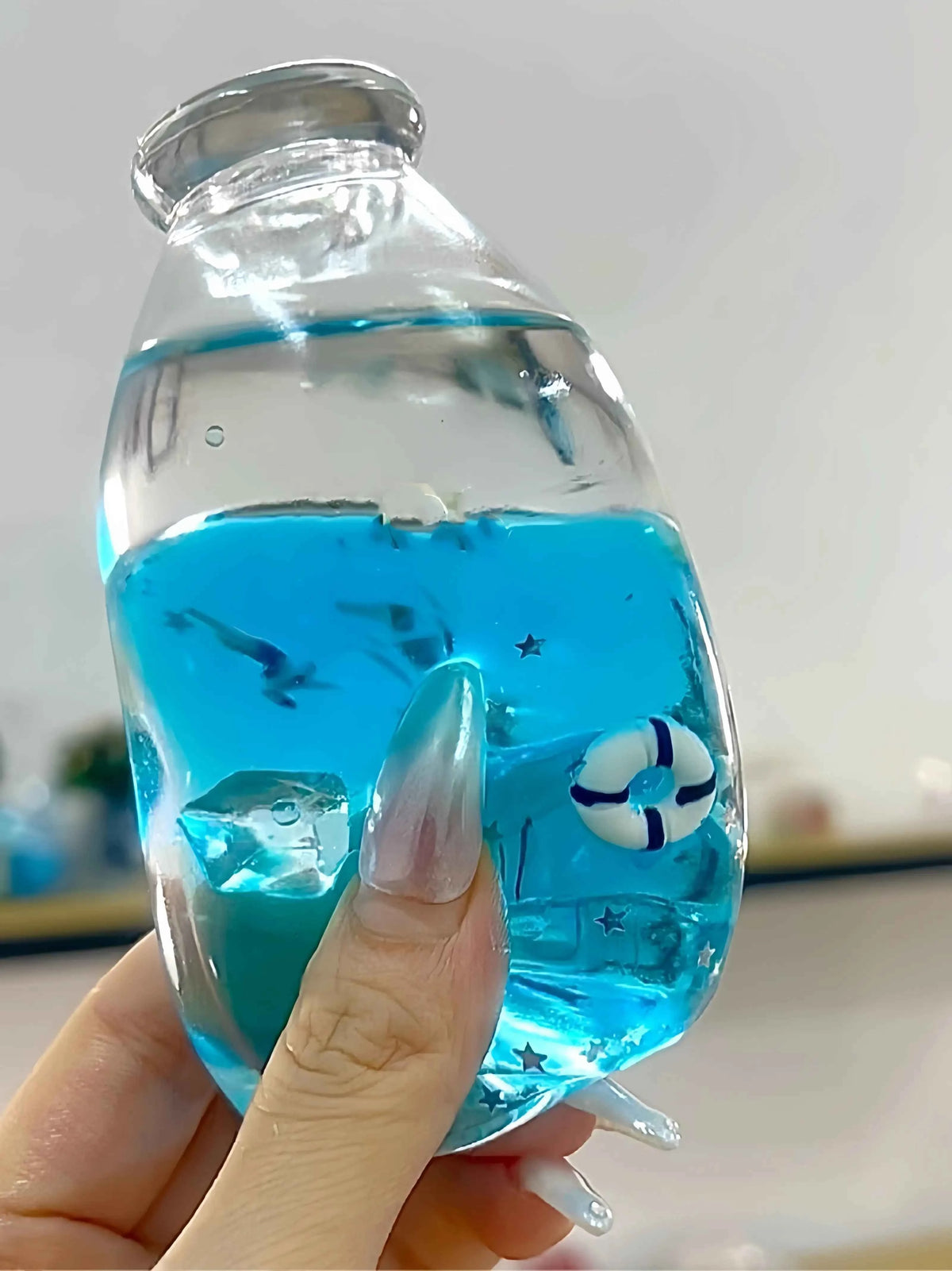 Squishies CHIBOKI de botellas con arena por capas