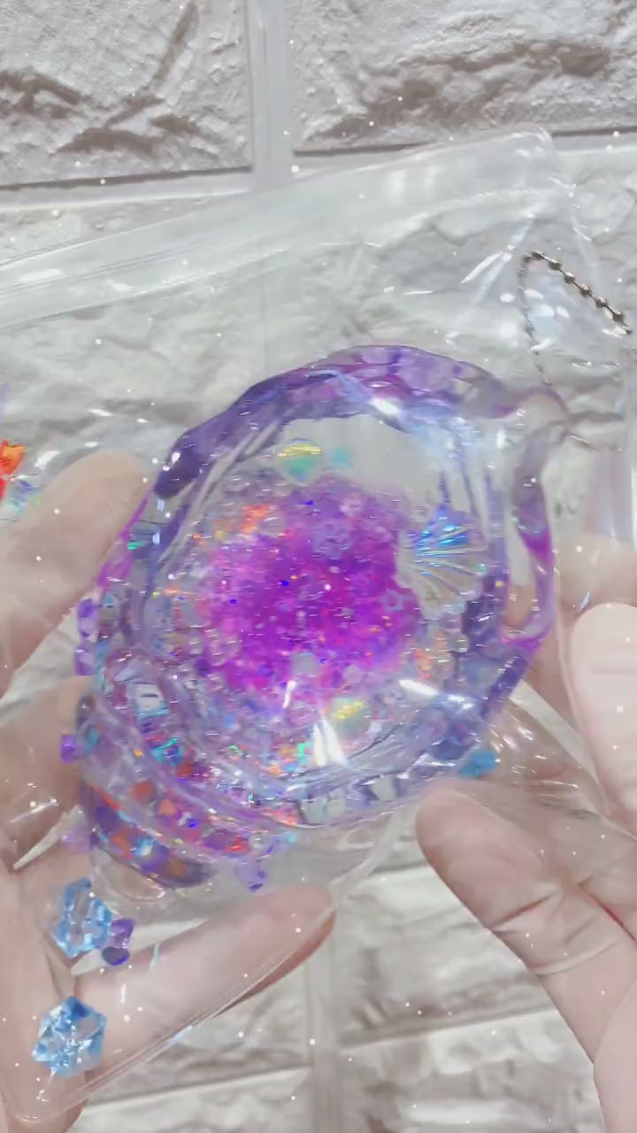 Squishy de concha con purpurina holográfica