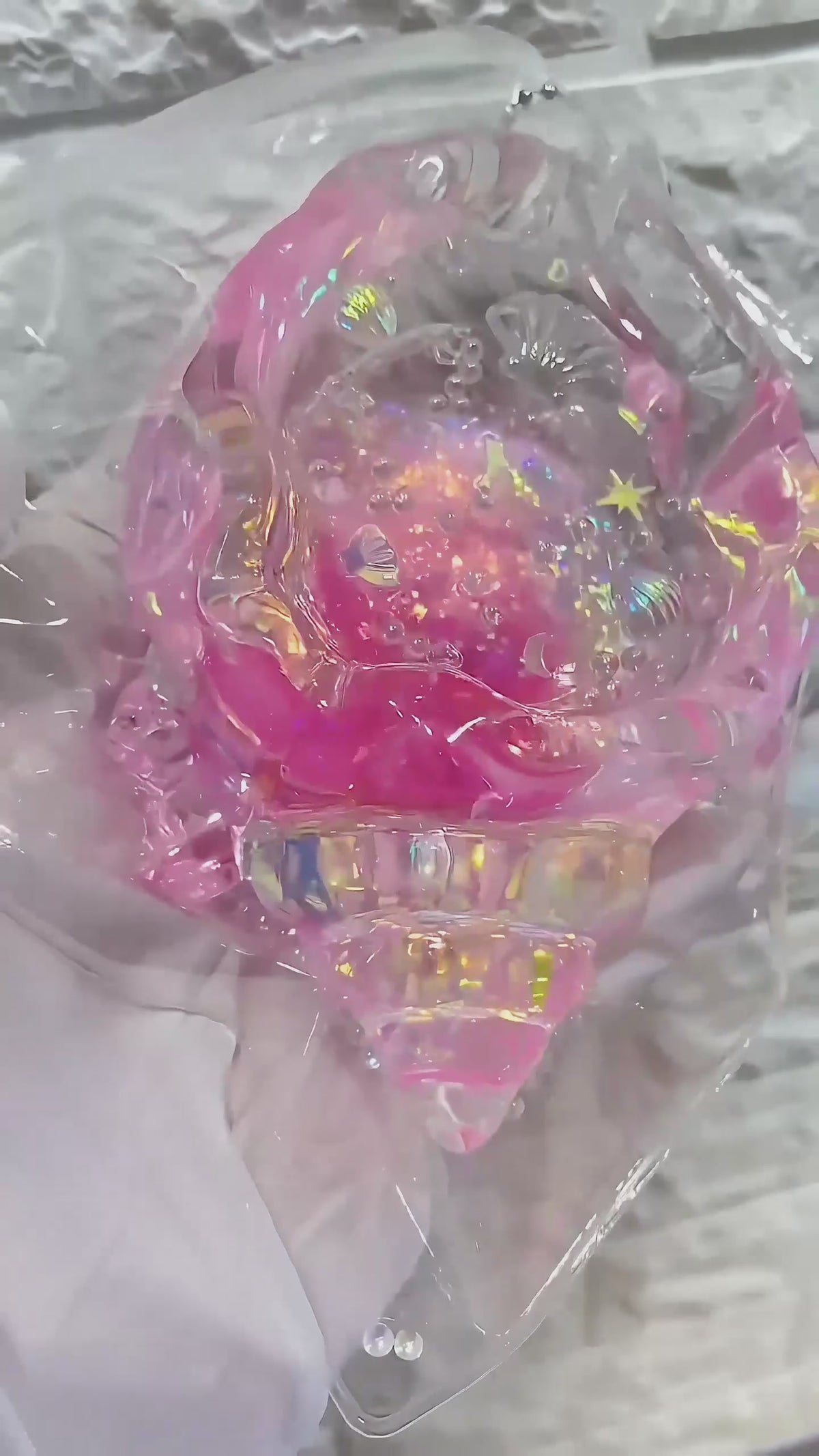 Squishy de concha con purpurina holográfica