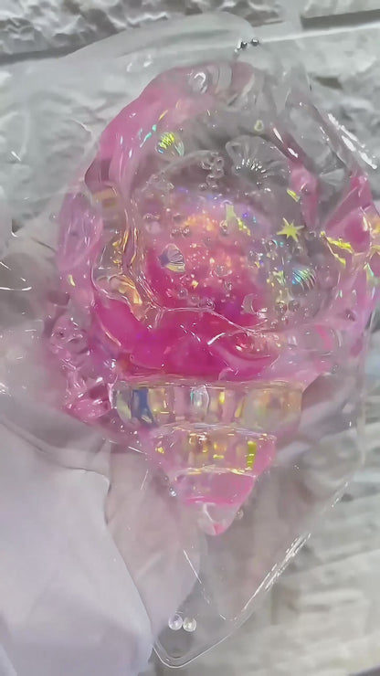 Squishy de concha con purpurina holográfica