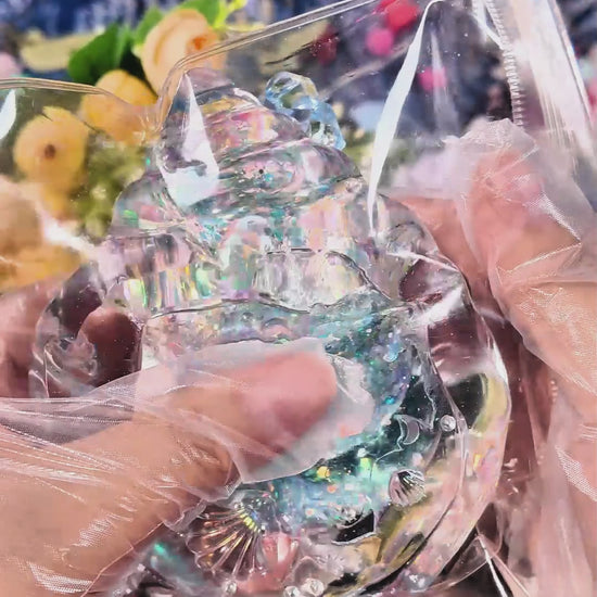 Squishy de concha con purpurina holográfica