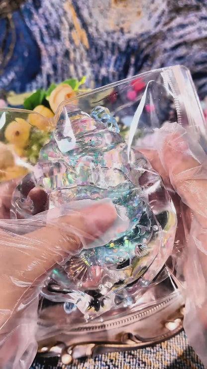 Squishy de concha con purpurina holográfica